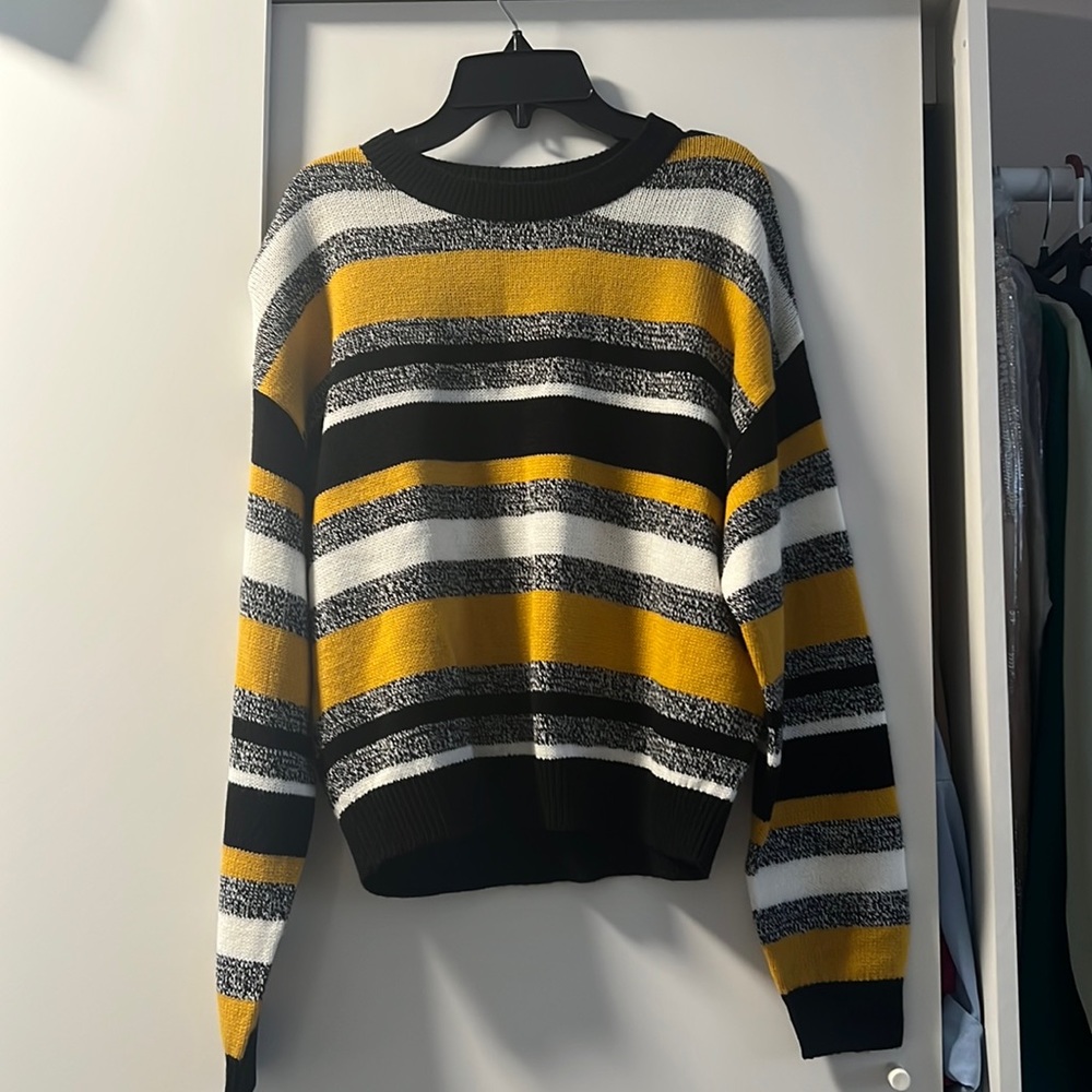 Sweater. Size medium. Never worn before.